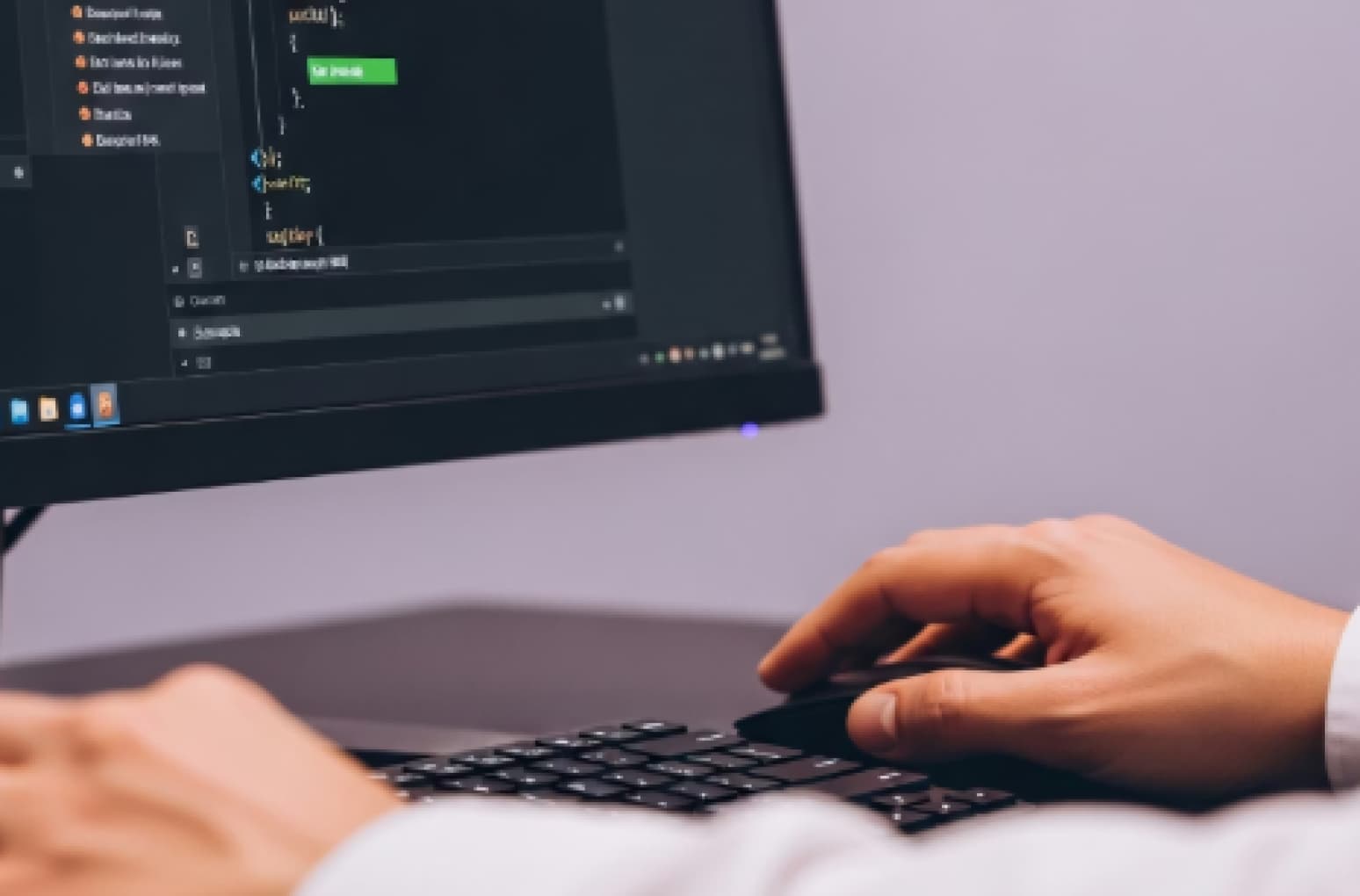 Developer building an LMS platform, hands on keyboard at a laptop