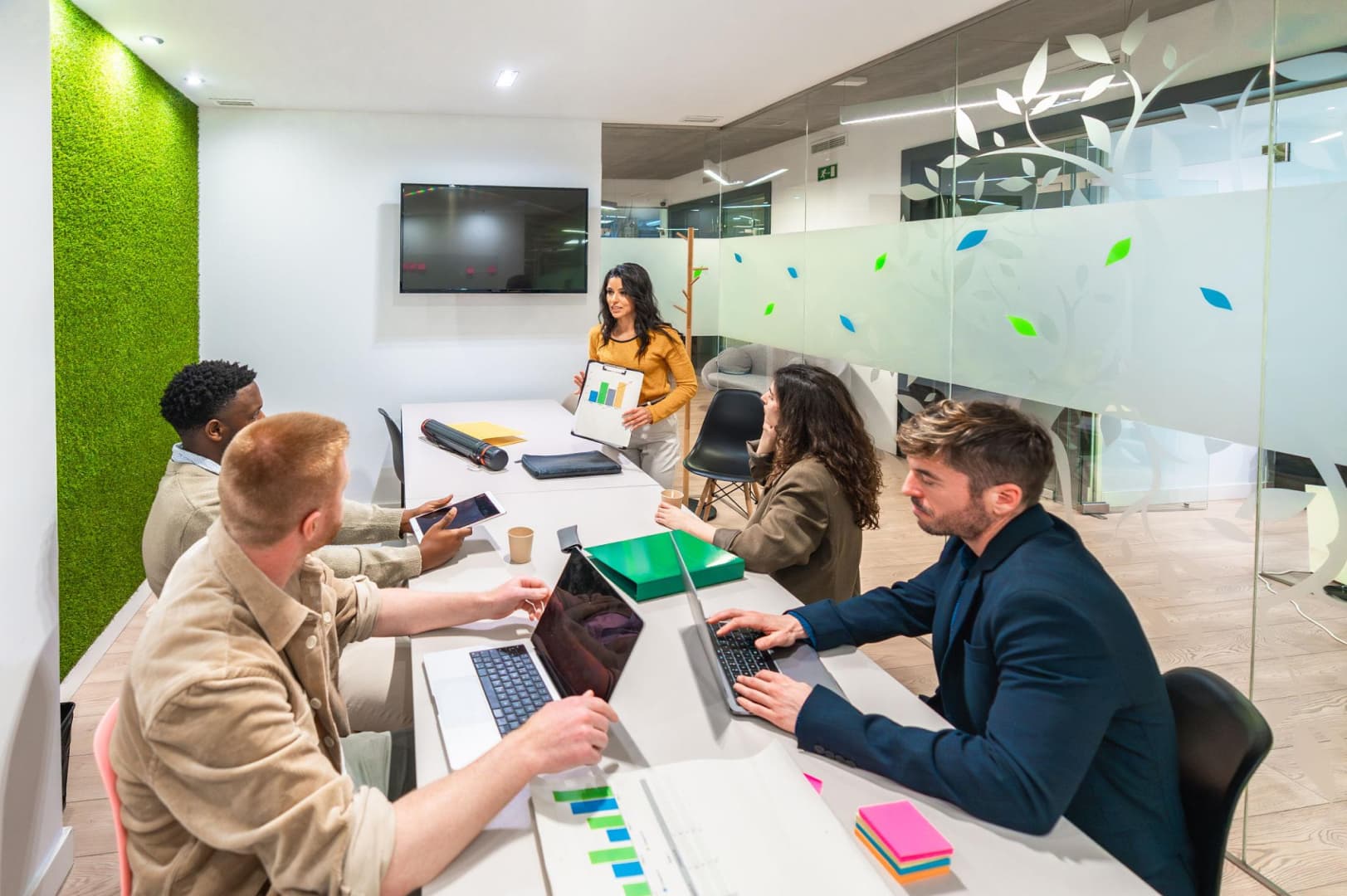 Team reviewing loyalty programme revenue metrics on a laptop