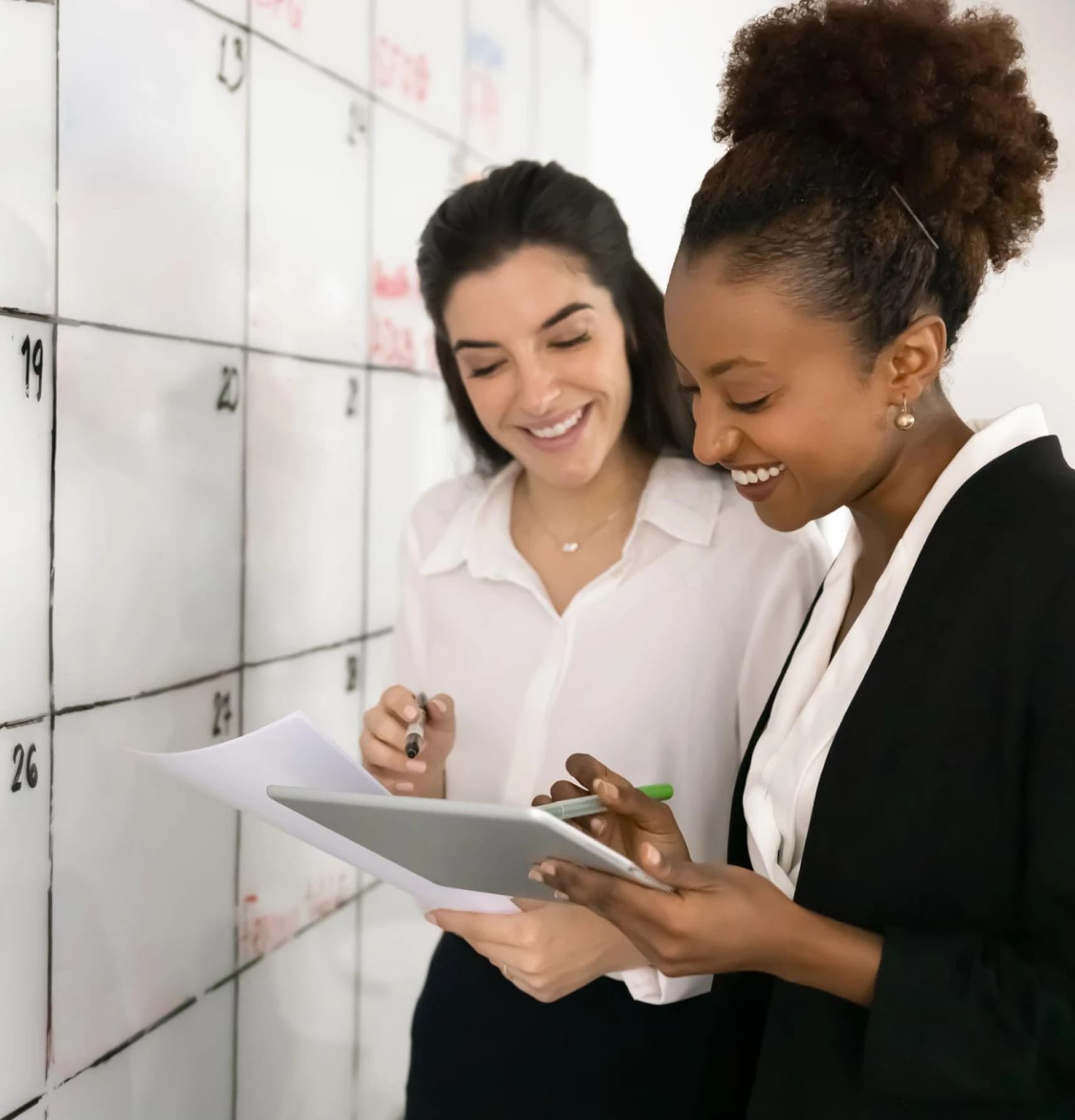 Two teammates collaborating on a sprint board in real time